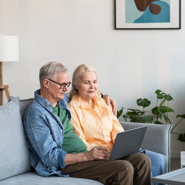 Grandpa and Grandmother watching laptop